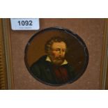 Pair of 19th century circular mounted portraits of gentlemen on papier mache panels