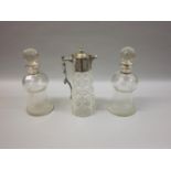 Pair of thistle shaped glass decanters with silver collars together with a cut glass claret jug with