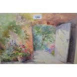 A.E. Dangerfield, watercolour, walled garden gateway with various flowers, signed, in a modern
