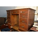 Late 19th / early 20th Century mahogany desk having green leather inset top above an arrangement