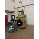 Two metal railway lamps