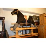 Mid 20th Century plush covered rocking horse on a wooden stand by Equestris, Arundel, England