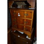 Reproduction yew wood three drawer dwarf chest and a pair of Edwardian side chairs