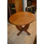 Art Deco circular oak coffee table on four shaped supports