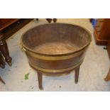 George II style oval mahogany brass bound wine cooler, raised on square tapering supports with brass
