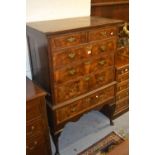 18th Century figured oak, figured walnut and crossbanded chest on stand, the moulded top above two