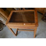 Oak bijouterie cabinet circa 1930, the hinged moulded top with bevelled glass insert above a plain