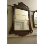 19th Century mahogany and gilded shaped edge wall mirror together with a quantity of other wall