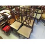 Set of four George III mahogany dining chairs, the pierced splat backs above drop-in seats on square