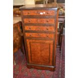 19th Century Continental amboyna and rosewood narrow side cabinet, the moulded top above four