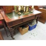 Victorian mahogany library table, the green tooled leather inset top above three frieze drawers