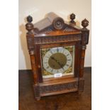 Late 19th or early 20th Century walnut bracket clock of Arts and Crafts design, the gilt brass