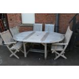 Good quality modern teak circular extending garden table by Westminster, together with six