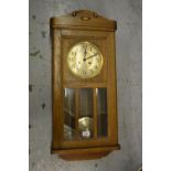 Mid 20th Century oak cased Vienna style wall clock having circular dial with Arabic numerals and two