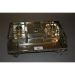 Early 20th Century rectangular silver plated two bottle inkstand with central stamp box (minus ink