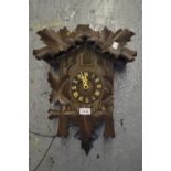 Swiss carved wooden two train weight driven cuckoo clock