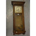 1930's oak Vienna style rectangular wall clock with a silvered dial, Arabic numerals and two train