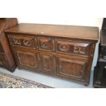 Good quality reproduction oak dresser base, the plank top above three drawers and two moulded