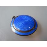 Circular silver and blue enamel decorated pendant compact