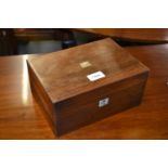 19th Century rosewood work box, the hinged cover enclosing a silk and paper lined interior with