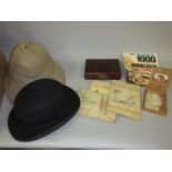 Dunn & Co. bowler hat, a pith helmet, a small quantity of mother of pearl gaming counters, red