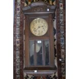 Early 20th Century mahogany rectangular wall clock, the silvered dial with Arabic numerals and three