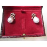 Pair of grey cultured pearl drop earrings set with diamond bow tops