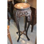 19th Century Chinese circular jardiniere stand, having marble inset top above a floral carved and