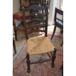 Set of four late 19th or early 20th Century ladder back dining chairs with rush seats