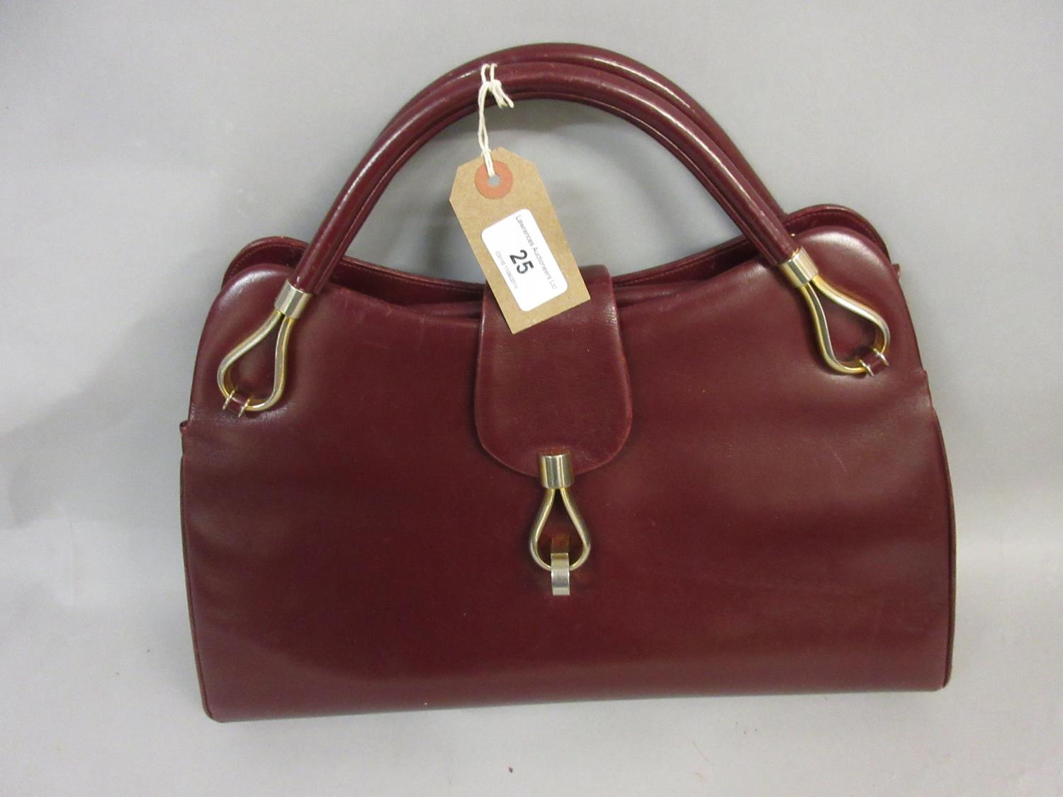 Ladies burgundy leather handbag by Dunhill