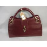 Ladies burgundy leather handbag by Dunhill