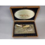 Walnut inlaid cutlery box containing a quantity of miscellaneous items including paper knives,