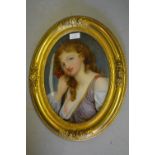 Pair of 19th Century French oval gilt framed verre eglomise pictures, portraits of girls, 12ins x
