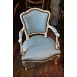 Reproduction white painted and parcel gilt open armchair with blue upholstered padded back and