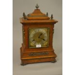 Late 19th Century German oak gilt metal mounted bracket clock, the silvered and gilded dial with