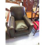 1940's Child's brown leather upholstered armchair with loose cushion, having original studwork on