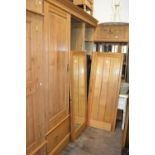 Late Victorian Maple and Co. ash wardrobe, the moulded cornice above three doors enclosing linen