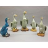 Graduated set of four 20th Century Chinese porcelain figures of seated ducks and another similar