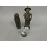 Small bronze figure of a man smoking a long pipe and carrying a document (Upper Volta ?), together