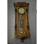 19th Century Continental walnut cased Vienna wall clock, the enamel dial with Roman numerals, 39.