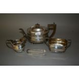 George III London silver teapot with boxwood handles, makers mark I.C., together with a similar