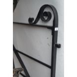 Modern good quality black painted wrought iron double gate having scroll work detailing and integral