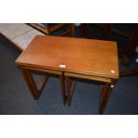 McIntosh type nest of three rectangular occasional tables, the swivel fold-out top above shaped