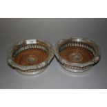 Pair of Matthew Boulton and Co. plated on copper wine bottle coasters with turned wooden inserts