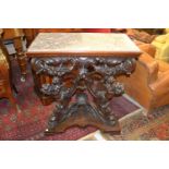 19th Century Italian walnut console table having grey flecked marble top, above a heavily carved
