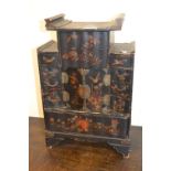 Oriental black lacquered bird, floral and gilt decorated table cabinet having multiple drawers