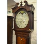 Unusual George III oak and mahogany crossbanded longcase clock, the swan neck pediment above an oval