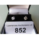 Pair of diamond solitaire stud earrings, approximately 0.60ct total