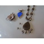 Two large pendants and a large silver necklace