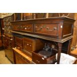 18th Century oak dresser, the boarded shelf back above three drawers raised on turned supports